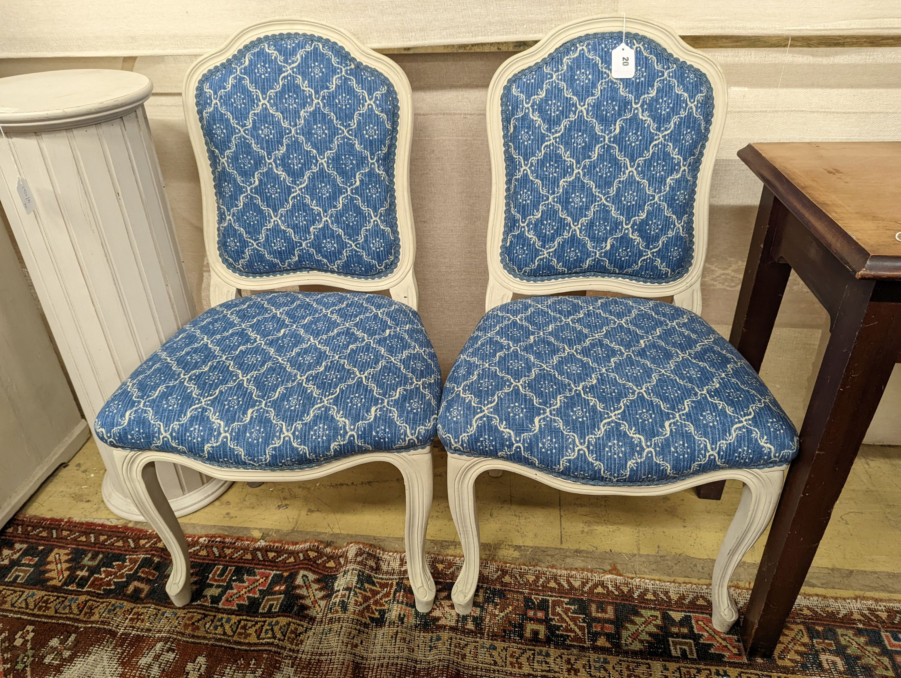 A pair of modern French painted upholstered side chairs